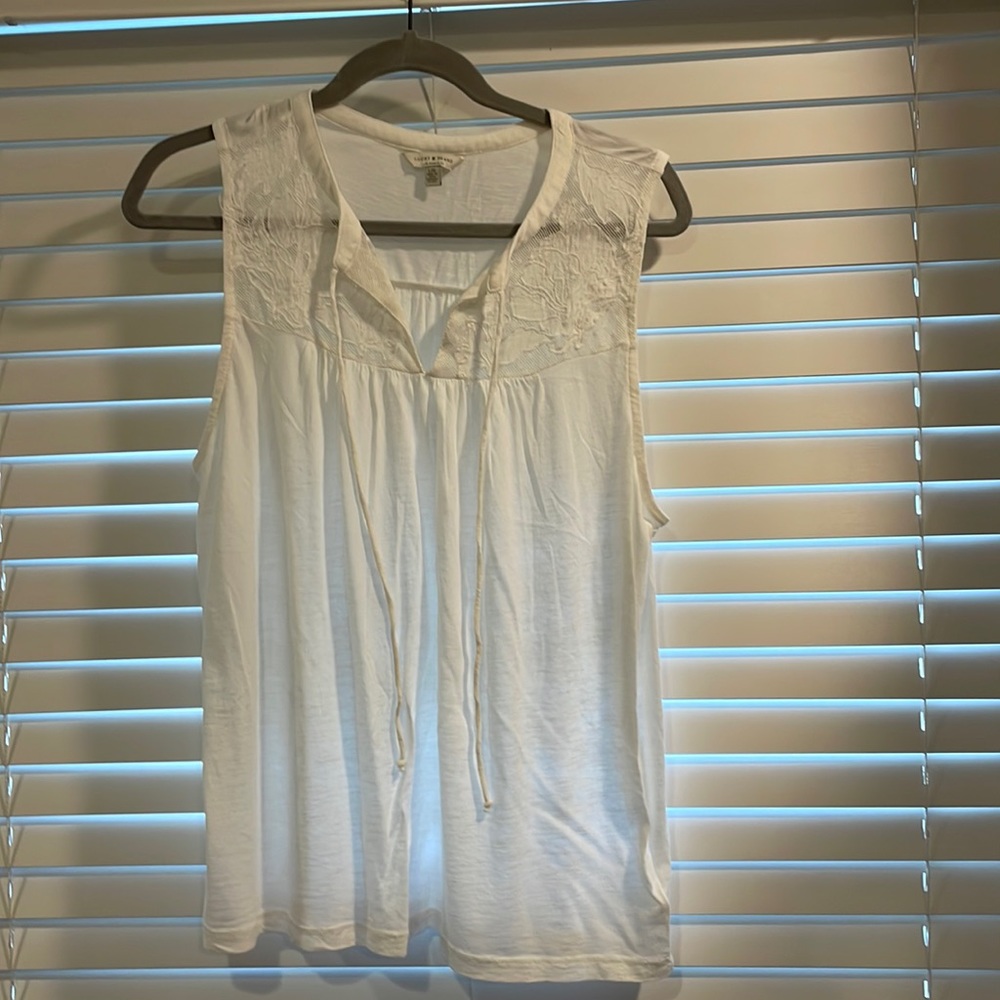 Sleeveless white blouse